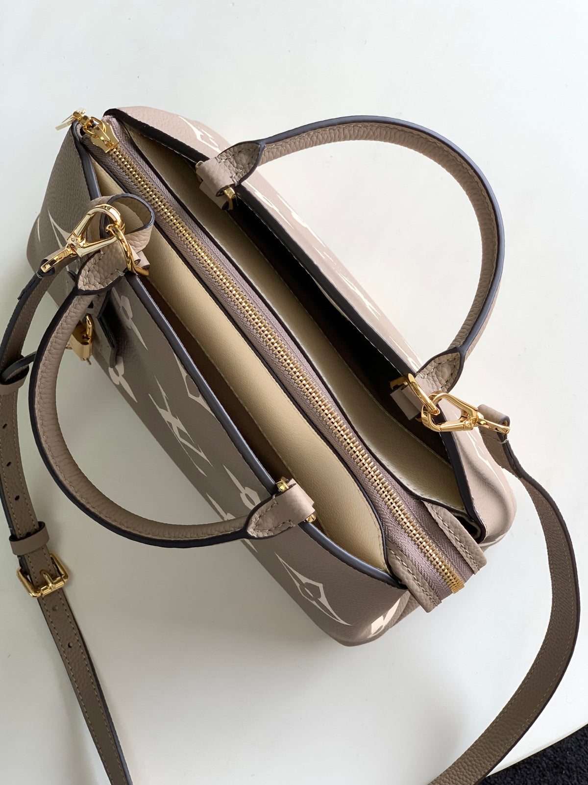 Louis Vuitton Rivoli PM Monogram Empreinte Leather Bag - Turtledove