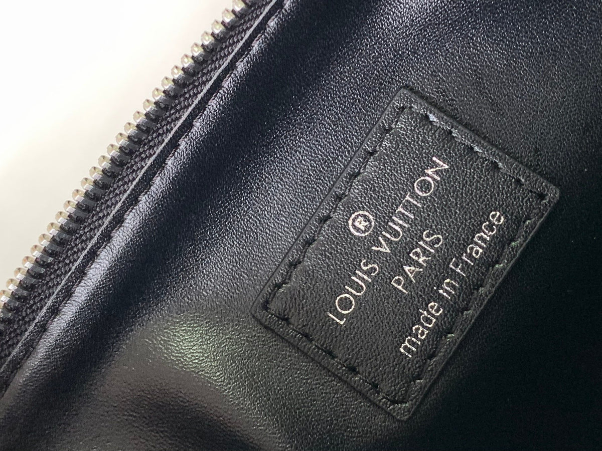 Black Embossed Monogram Crossbody Bag with Chain Detail and Wide Adjustable Strap