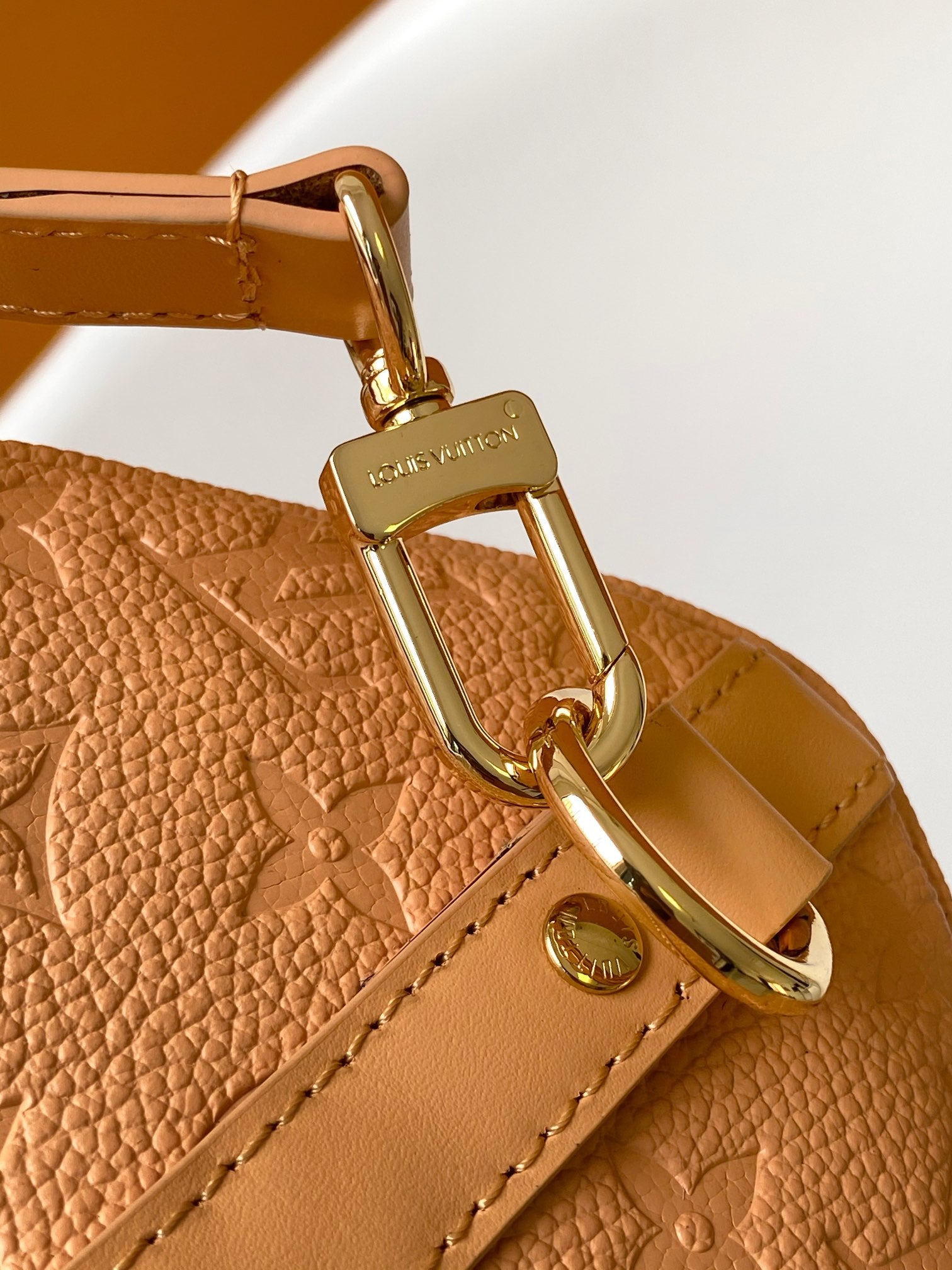 Elegant Tan Monogram Embossed Leather Satchel Bag with Top Handles and Crossbody Strap